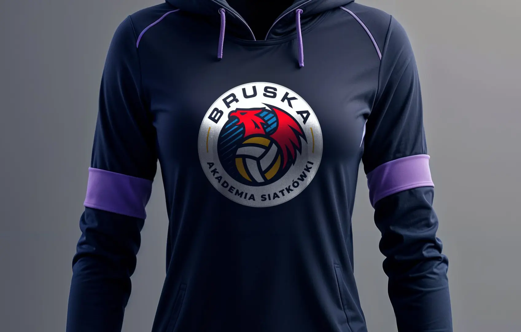 Logo Bruska Akademia Siatkówki na granatowej bluzie, realizacja Skubi Art