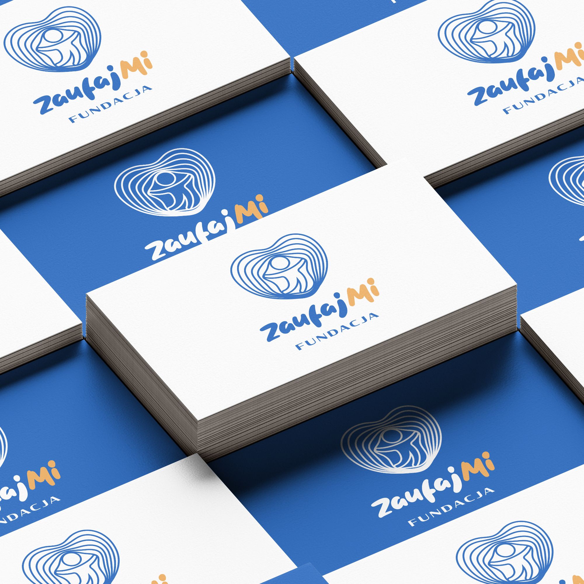 Wizualizacja logo Fundacji Zaufaj Mi na materiałach marki
